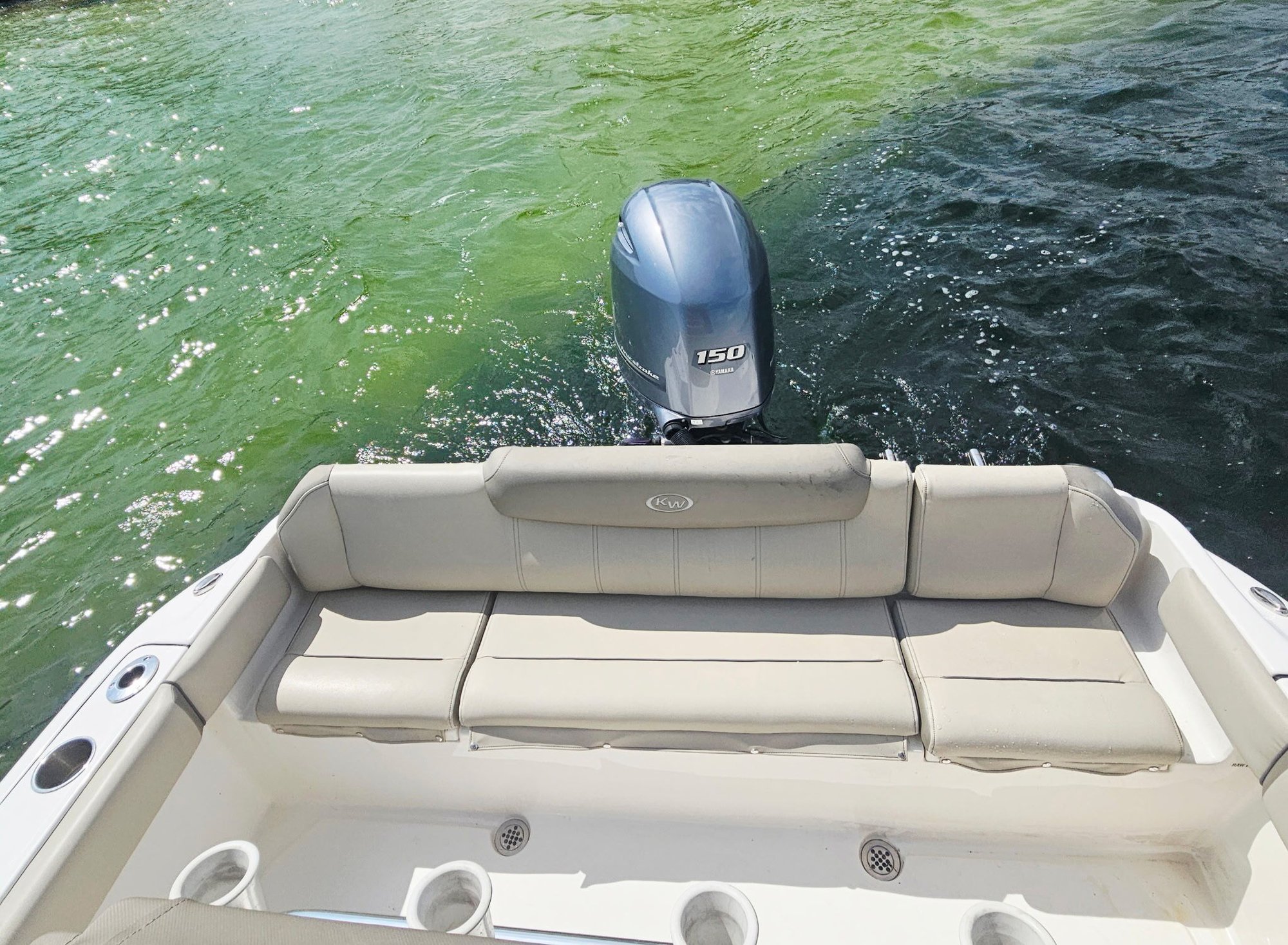 view of the rear bench seating and motor on a 22 foot key west center console