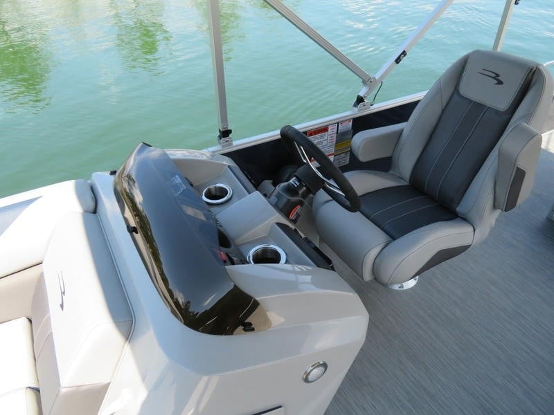 drivers seat of a luxury pontoon boat