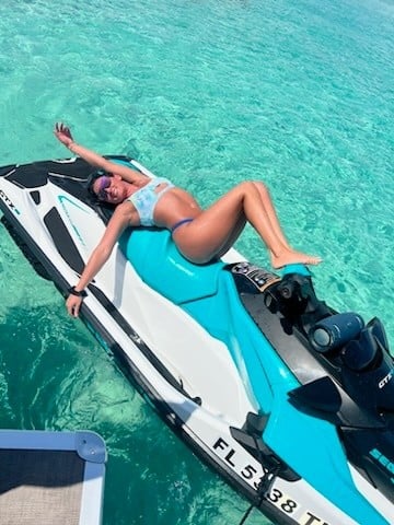 woman man laying on a luxury seadoo at 30A