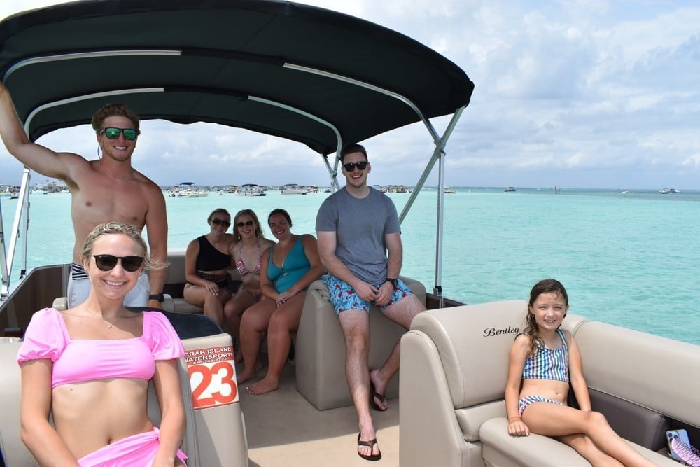 family on pontoon boat at crab island