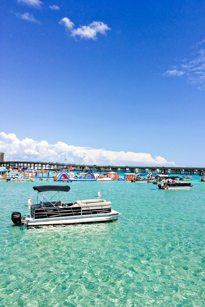 multiple pontoon boats at crab island