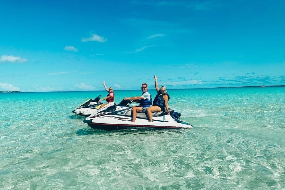 family having fun on two waverunners in destin florida