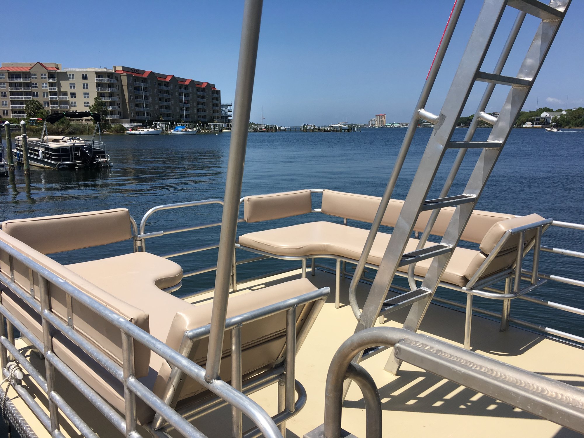 seating on a double decker party pontoon boat