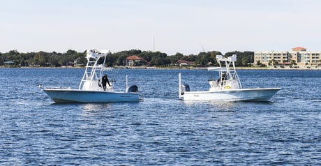 two inshore bay boats floating next to each other in destin, fl