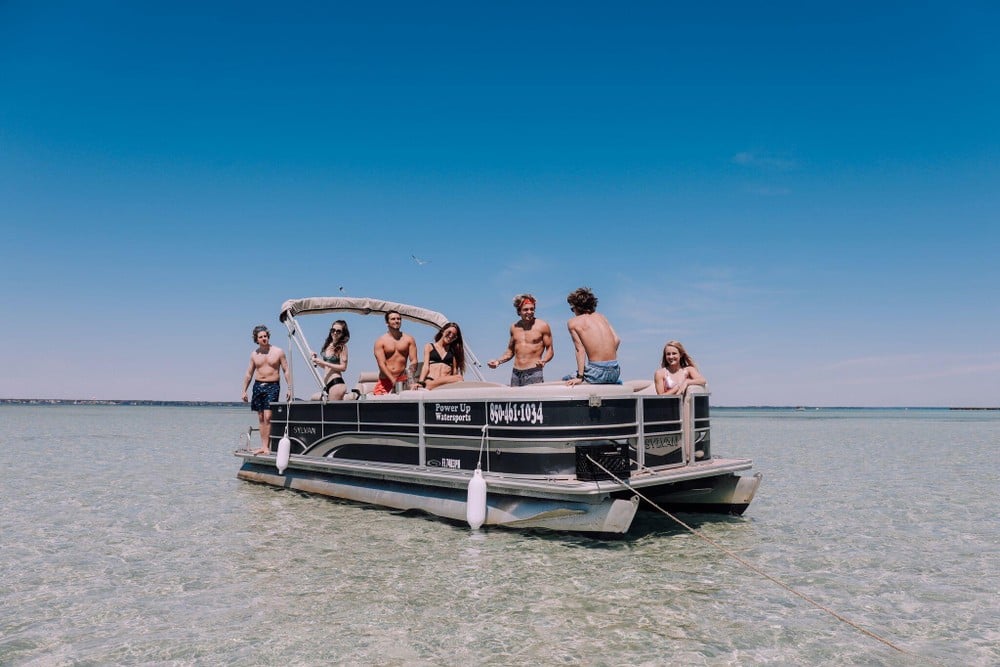 people on a pontoon boat at okaloosa island