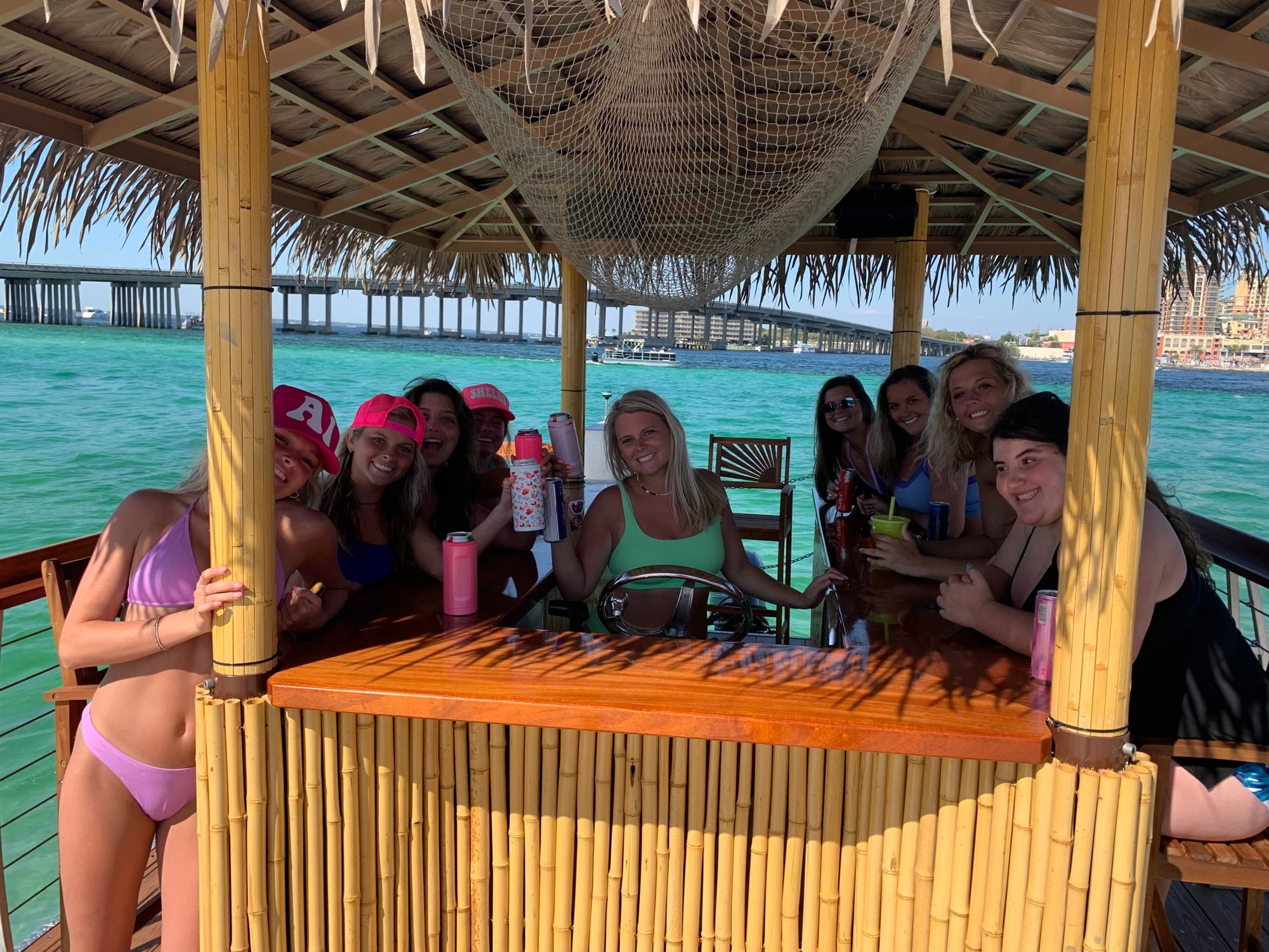 women having fun on a tiki boat at crab island