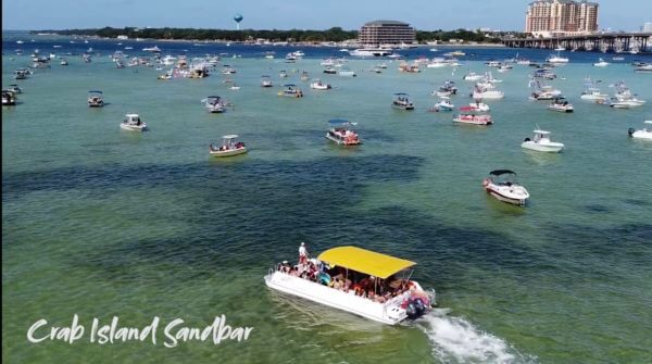 shuttle boat driving through crab island in destin florida