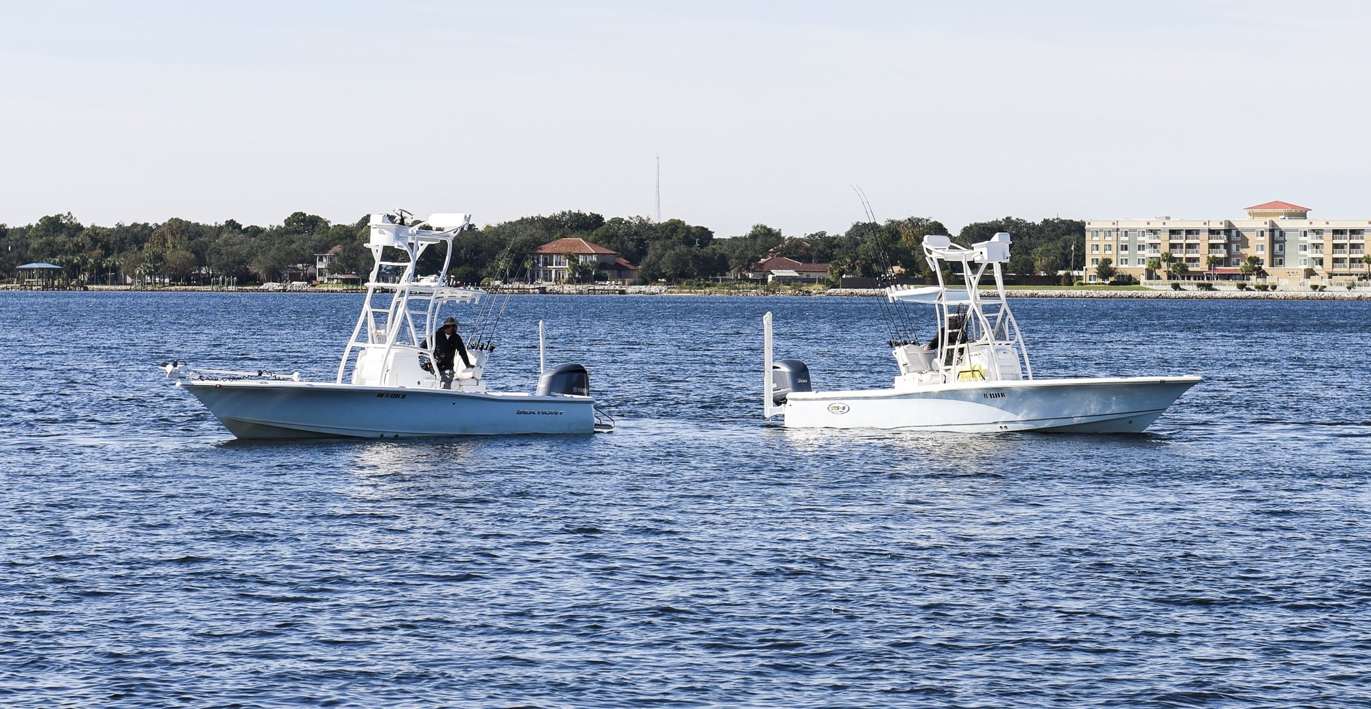 two inshore bay fishing boats in the destin harbor