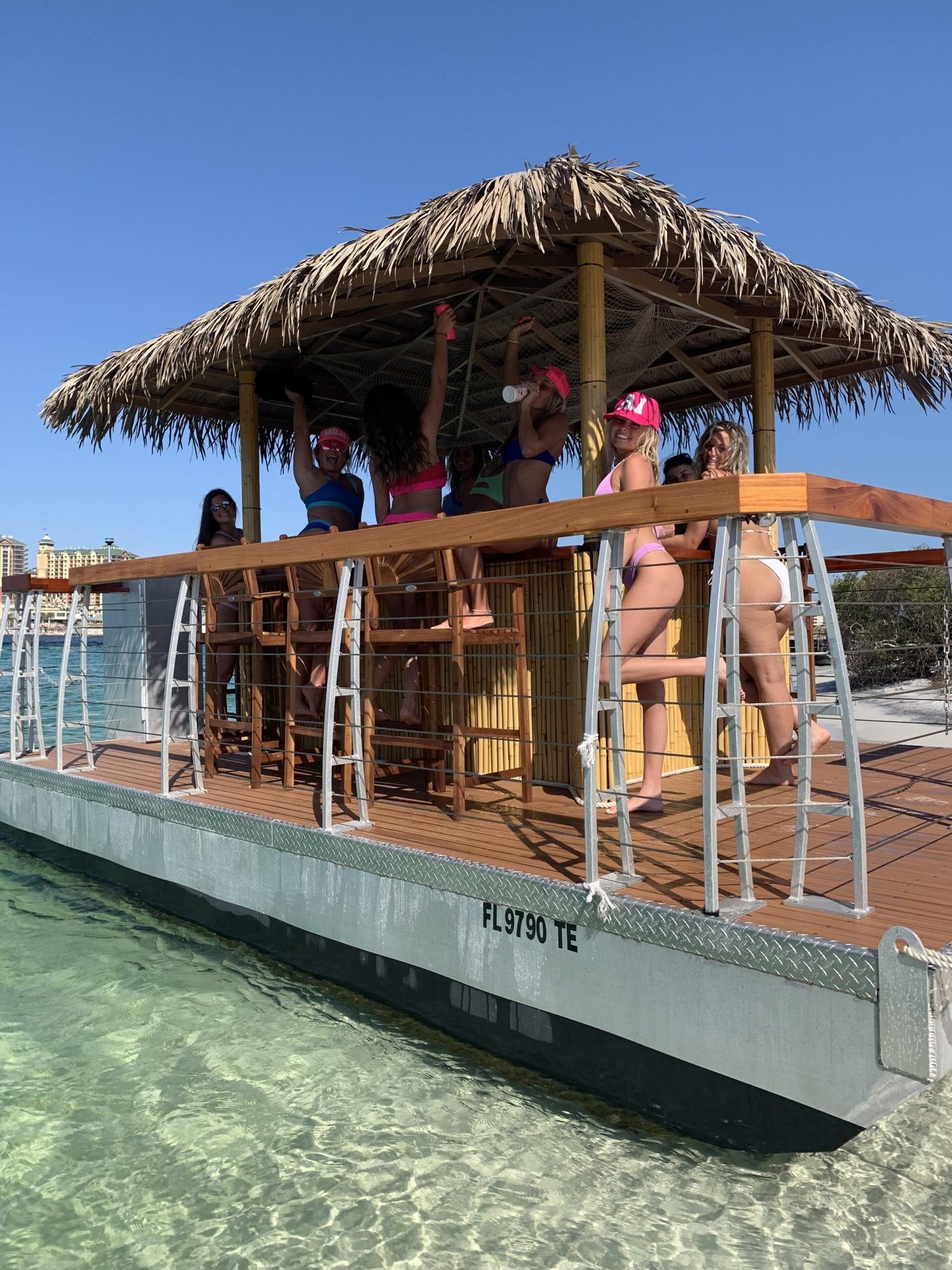 people having fun on a tiki boat at crab island