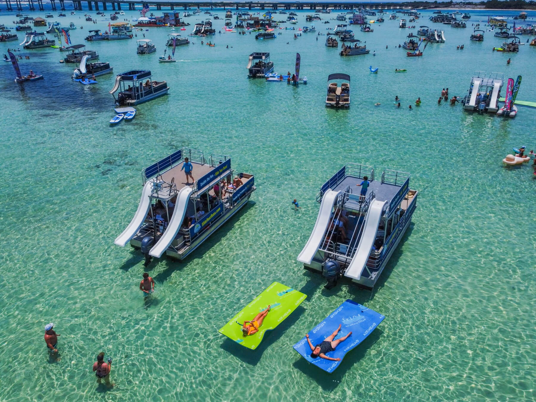 two double decker pontoon boats at crab island on a summer day in destin florida 