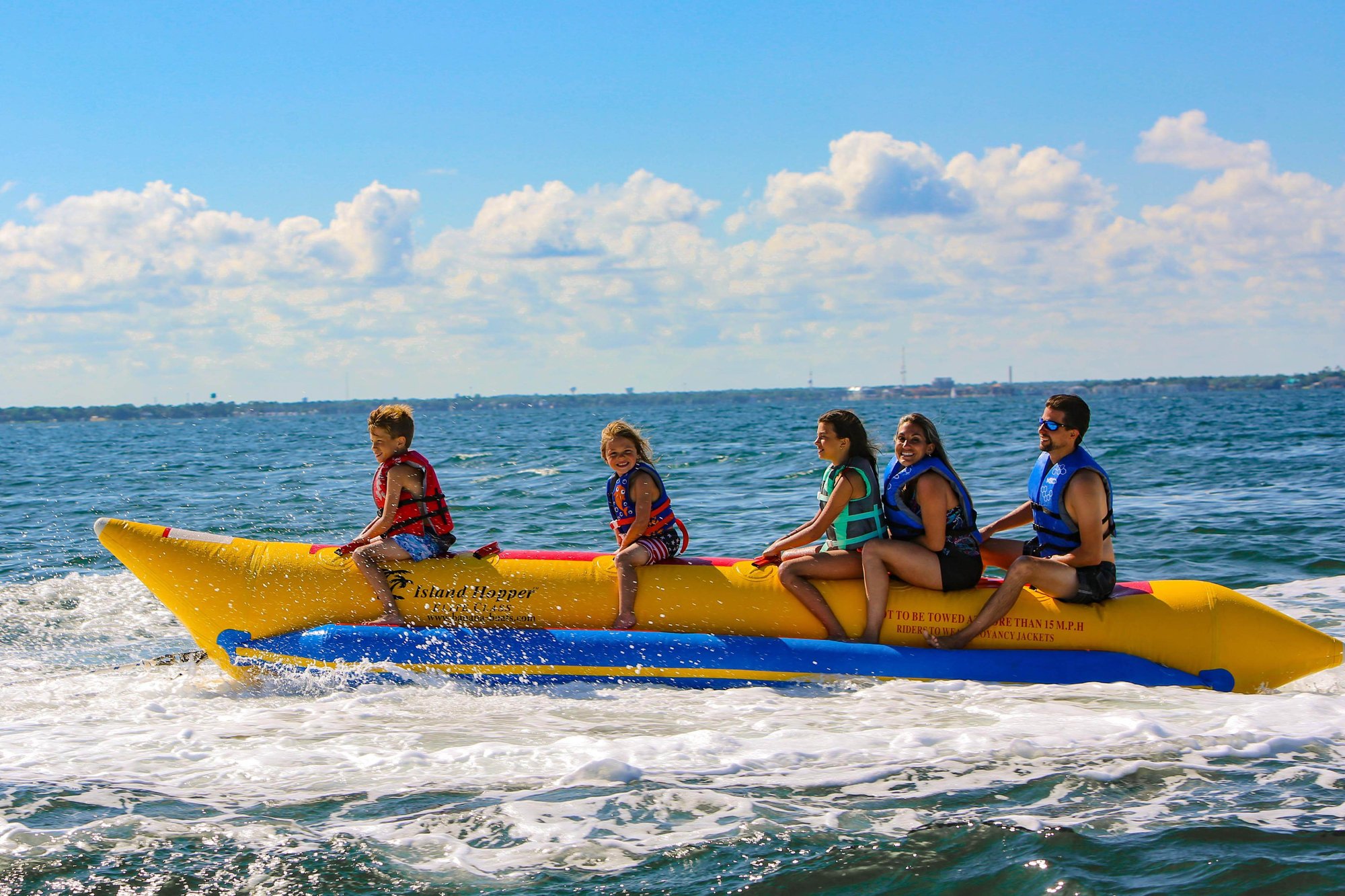 five children on a banana boat in destin, florida