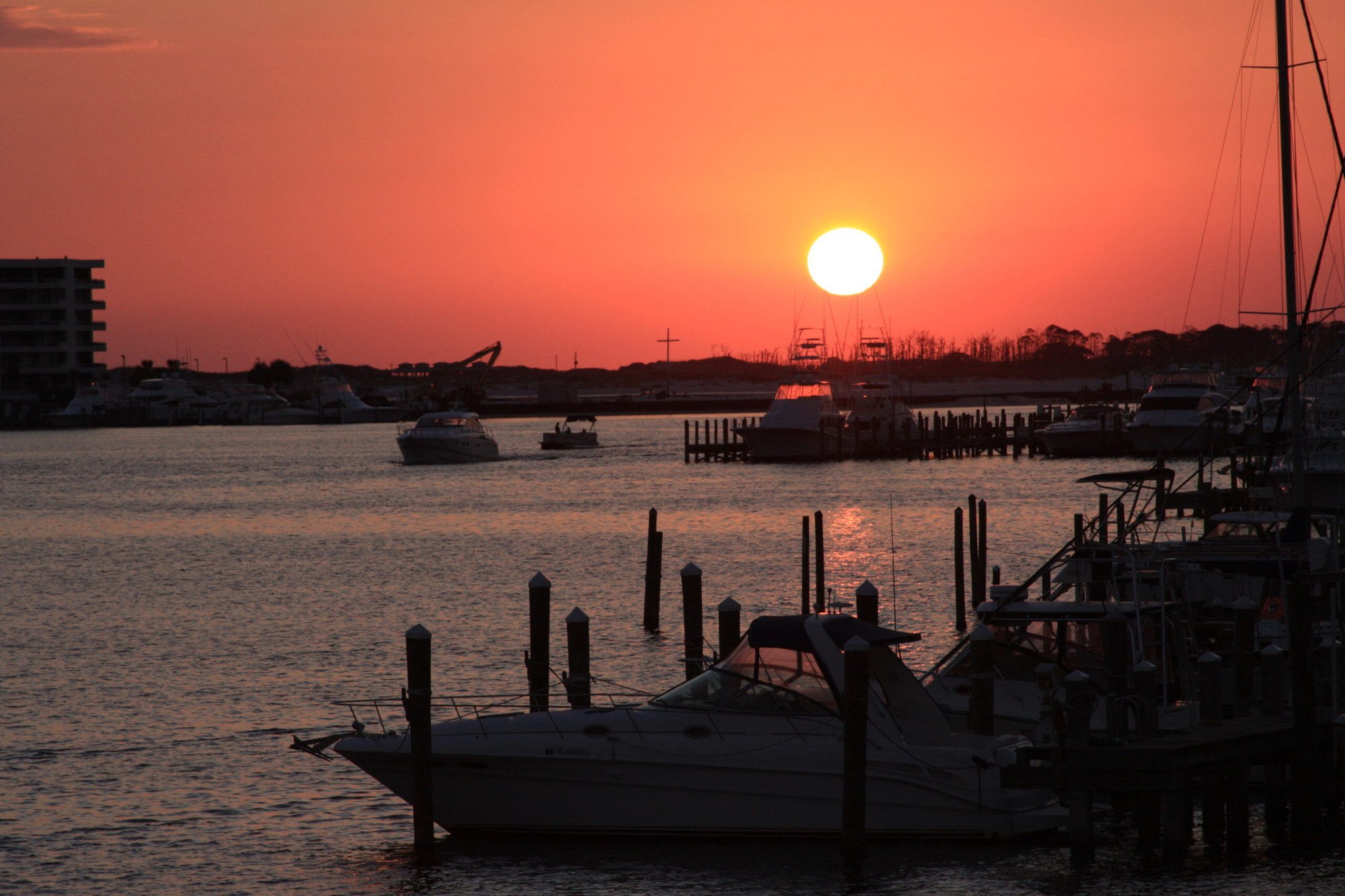 view of the sunset from the destin harbor in destin florida