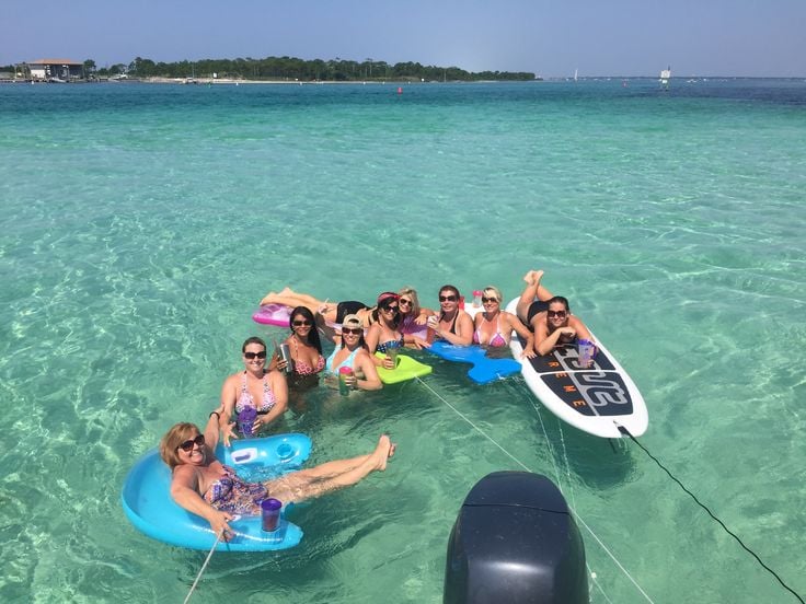 small group floating at crab island sand bar destin beach