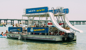 people hanging out on double decker pontoon boat with two slides in destin florida